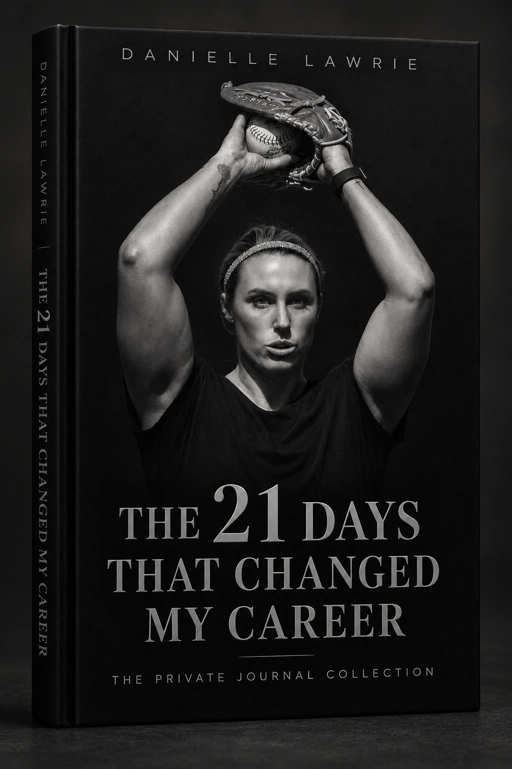 Danielle Lawrie holding her glove overhead, in black and white on a black background.